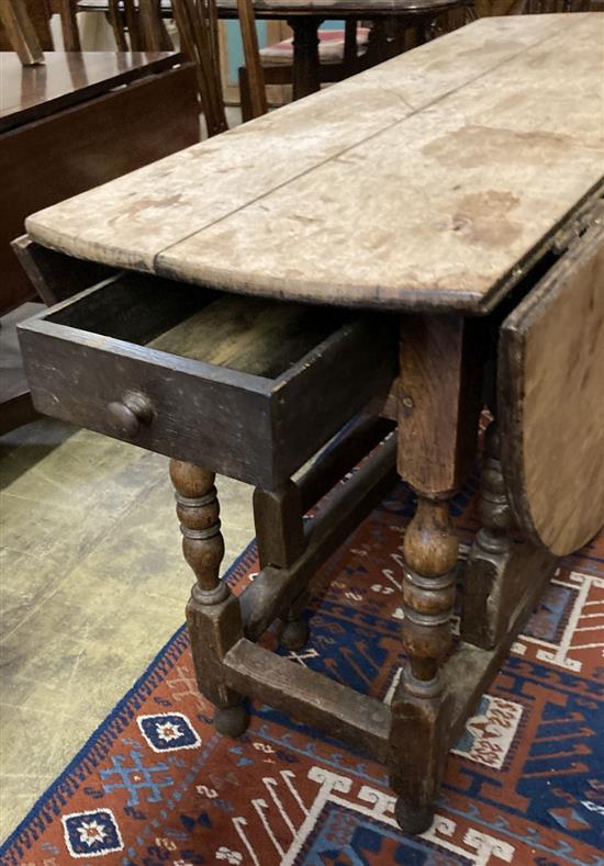 An oak gateleg table, width 104cm depth 45cm height 74cm